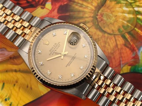 rolex oyster perpetual stainless steel and gold man 1987 price